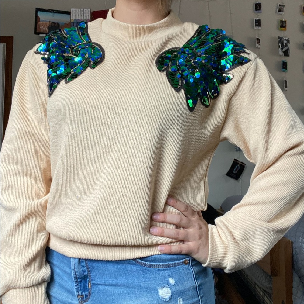 Shein beige sweater with green and blue sequin winged shoulders
